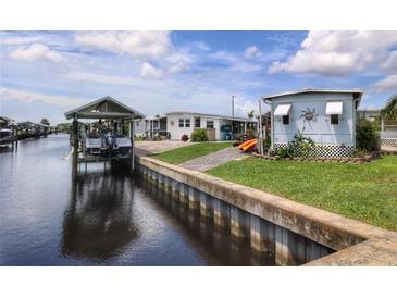 Waterfront property with boat dock and two mobile homes at 126 S Saint Thomas Cir, Apollo Beach, FL 33572