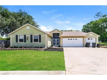 Charming single-Gathering home with a two-car garage at 18940 Emerald Ridge Dr, Hudson, FL 34667