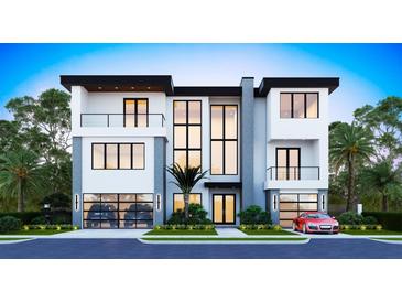 Modern two-story home with two-car garage and balcony at 1013 Symphony Isles Blvd, Apollo Beach, FL 33572