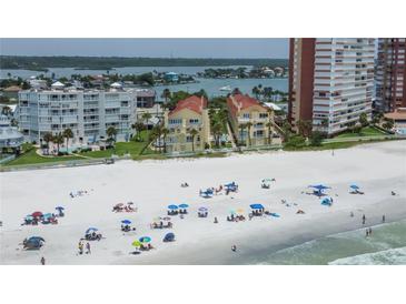 Aerial view of beachside condos with white sand beach and ocean at 17960 Gulf Blvd # 212, Redington Shores, FL 33708