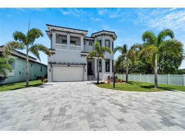 Two-story house with gray stone driveway and landscaping at 519 Treviso Dr, Apollo Beach, FL 33572