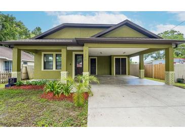 Charming craftsman style home with covered carport at 7110 N Taliaferro Ave, Tampa, FL 33604