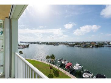 Stunning panoramic view of waterfront with boats and cityscape at 400 64Th Ave # 704, St Pete Beach, FL 33706