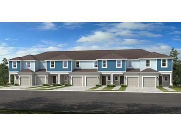 Three-unit townhome building with attached garages and light blue siding at 5920 Whetstone Ct, Palmetto, FL 34221