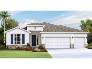 Two-story house with a three-car garage, stone accents, and a landscaped lawn at 16726 Harvester Ter, Lakewood Ranch, FL 34211