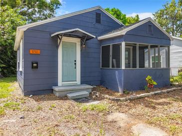 Charming blue house with a screened porch at 1751 28Th S St, St Petersburg, FL 33712