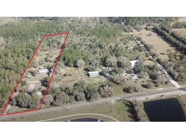 Aerial view of property showing a house and large lot of land at 30737 Elam Rd, Wesley Chapel, FL 33545