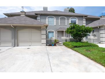 Two-story townhome with attached garage at 14028 Notreville Way, Tampa, FL 33624