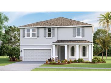 Two story home with gray siding, gray roof, and landscaping at 18227 Fattoria Ter, Lakewood Ranch, FL 34211