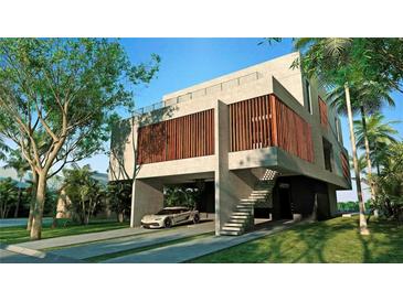 Modern home with concrete exterior and attached garage at 1725 Gulf Rd, Tarpon Springs, FL 34689