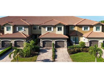 Luxury townhouses with tile roofs and garages at 13506 Messina Loop # 105, Bradenton, FL 34211