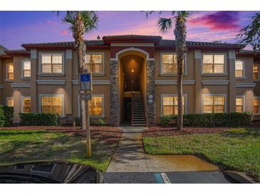 Attractive condo building exterior at dusk at 2220 Chianti Pl # 8-0812, Palm Harbor, FL 34683