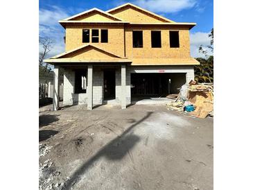 Two-story house under construction, featuring a modern design and large windows at 815 W Braddock St, Tampa, FL 33603
