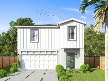 Two-story farmhouse style home with white siding and green door at 7617 Amherst St, Tampa, FL 33625