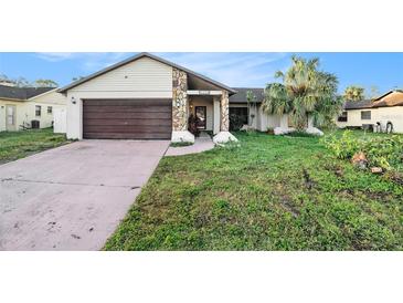 Cozy one-story house with attached garage at 7022 Arbor View Ln, New Port Richey, FL 34653
