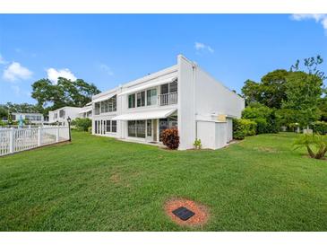 White two-story home with lush lawn at 1655 S Highland Ave # E223, Clearwater, FL 33756