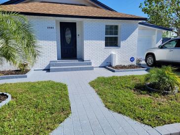Charming ranch home with newly paved walkway at 2503 W Marquette Ave, Tampa, FL 33614
