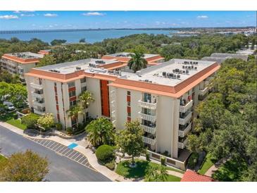 Aerial view of a condo building near the water at 2630 Pearce Dr # 404, Clearwater, FL 33764