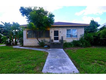 Brick ranch home with a walkway and landscaped yard at 14141 11Th St, Dade City, FL 33525