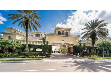 A luxurious condo building with a grand entrance and lush landscaping at 501 Knights Run Ave # 2120, Tampa, FL 33602