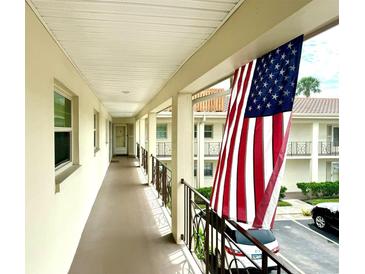 Clean condo hallway with American flag at 19029 Us Highway 19 N # 6-19, Clearwater, FL 33764