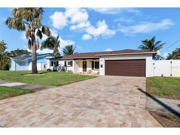 Updated single story home with a paver driveway and two car garage at 537 Dolphin Se Ave, St Petersburg, FL 33705