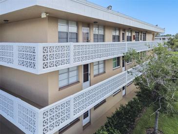 Apartment building with balconies and geometric designs at 5095 Bay Ne St # 306, St Petersburg, FL 33703