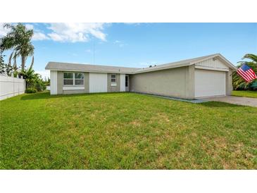 Ranch home with a spacious front yard at 3234 Jackson Dr, Holiday, FL 34691