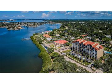 Aerial view of waterfront community with lush landscaping and bay access at 7037 Sunset S Dr # 602, South Pasadena, FL 33707