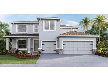 Two-story house with gray siding, two-car garage, and landscaping at 3410 Hazel Hollow Way, Plant City, FL 33565