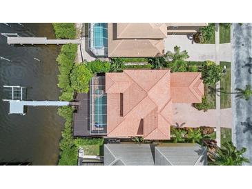 Overhead aerial view of home showing waterfront lot, pool, and the dock at 1233 Acappella Ln, Apollo Beach, FL 33572