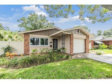 Updated Ranch style home with a landscaped front yard at 205 Se Monroe N Cir, St Petersburg, FL 33703