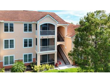 Three-story building with balconies and terracotta roof at 4138 Central Sarasota Pkwy # 1524, Sarasota, FL 34238