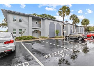 Exterior view of an apartment building with parking lot at 10800 Us Highway 19 N # 112, Pinellas Park, FL 33782