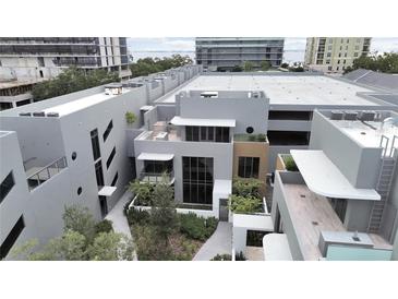 Modern building complex with lush landscaping and city views at 3030 W Santiago St # 4, Tampa, FL 33629