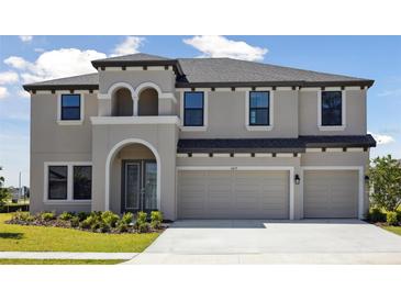 Beautiful two-story home with a three-car garage and well-maintained landscaping at 3437 Yellow Leaf Cir, Spring Hill, FL 34609