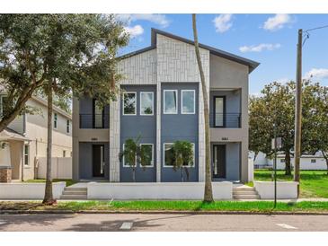 Modern two-unit building with gray and white exterior at 2138 -1 W Beach St, Tampa, FL 33607