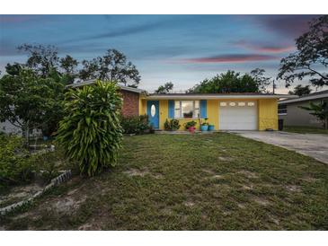 Ranch style home with colorful facade at 1627 Dander Dr, Holiday, FL 34690