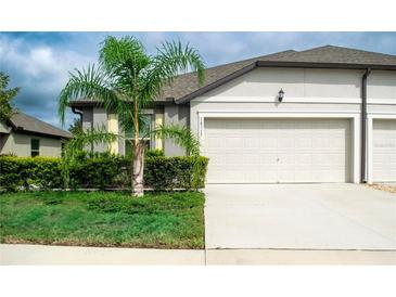 Single Gathering home with two-car garage and landscaping at 14117 Weddington Ter, Hudson, FL 34669