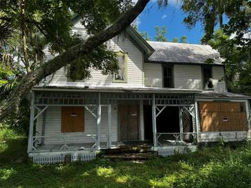 Older home needing renovation, with large porch at 4206 Durant Rd, Valrico, FL 33596