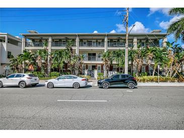 Beautiful condominium with lush tropical landscaping, multiple floors, and balconies provides a comfortable living space at 201 6Th S St # 106, St Petersburg, FL 33701