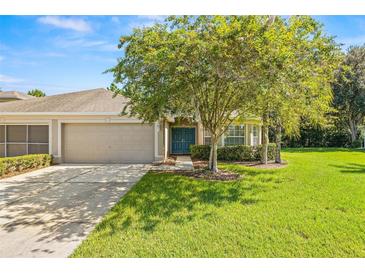Single-story home with a two-car garage at 9343 Rolling Circle, San Antonio, FL 33576
