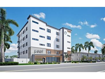 Modern building exterior, The Pearl, with parking and landscaping at 10126 Gulf Blvd # Ph1, Treasure Island, FL 33706