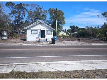 Charming single-story home with peaked roof and a 'For Sale' sign in the front yard at 2001 15Th S Ave, St Petersburg, FL 33712