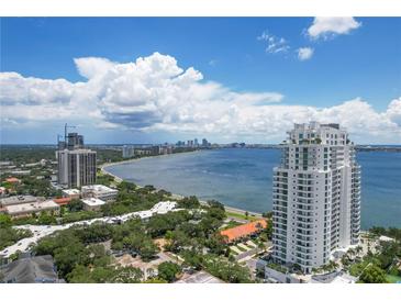 Aerial view of high-rise building near bay and city skyline at 3401 Bayshore Blvd # 1801, Tampa, FL 33629