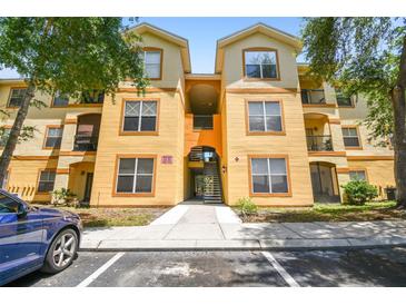 Inviting condo building with well-kept grounds and ample parking at 5608 Pinnacle Heights Cir # 305, Tampa, FL 33624