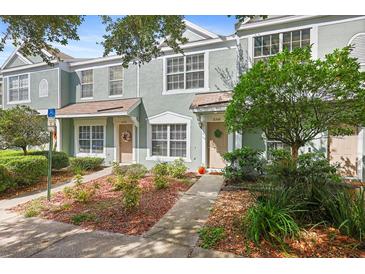 Exterior view of two-story townhouses with landscaping at 2316 Lake Woodberry Cir, Brandon, FL 33510