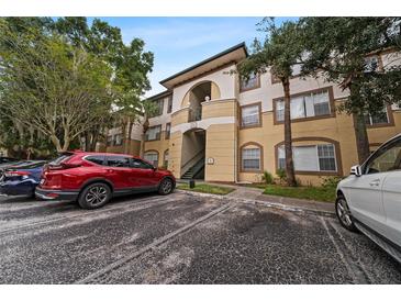 Condo building exterior with parking area at 17112 Carrington Park Dr # 922, Tampa, FL 33647