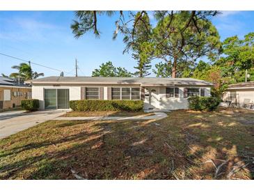 Ranch-style home with a well-maintained lawn and driveway at 2145 68Th S Ave, St Petersburg, FL 33712