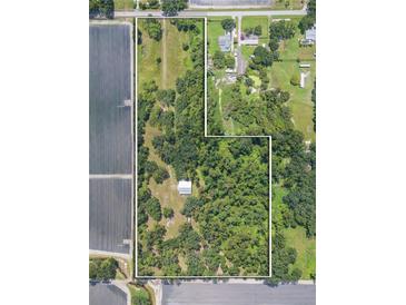 Aerial view of large property with home, barn, and fields at 2804 Holloway Rd, Plant City, FL 33567